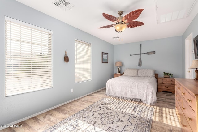 bedroom with ceiling fan and light hardwood / wood-style flooring