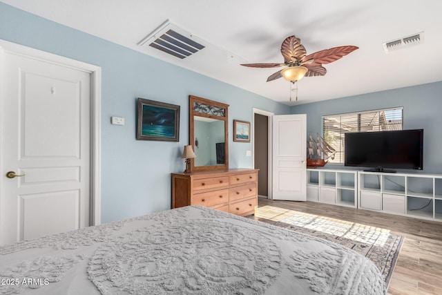 bedroom featuring ceiling fan and light hardwood / wood-style floors