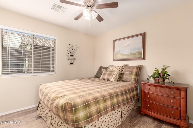 bedroom featuring light hardwood / wood-style floors and ceiling fan