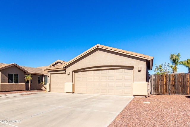 ranch-style house featuring a garage