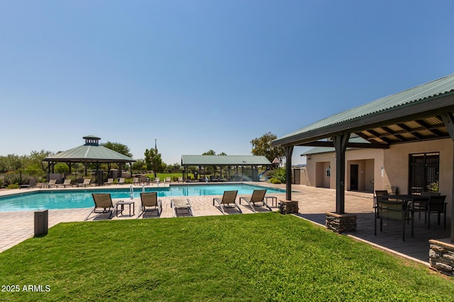 view of swimming pool with a gazebo, a patio, and a lawn