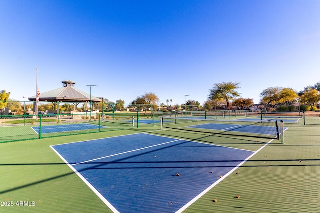 view of sport court featuring a gazebo and basketball hoop