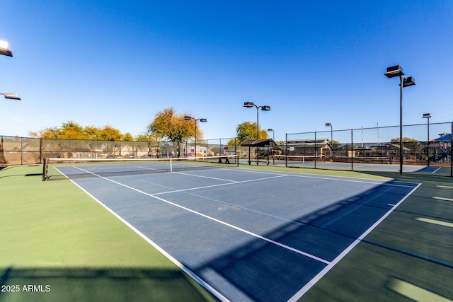 view of tennis court featuring basketball court