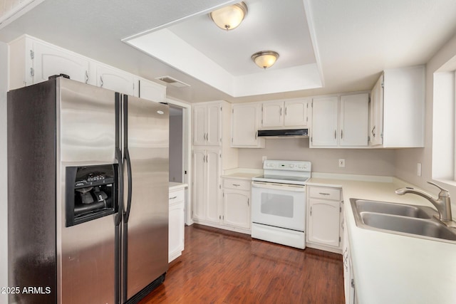 kitchen with stainless steel refrigerator with ice dispenser, white electric stove, a sink, a tray ceiling, and under cabinet range hood