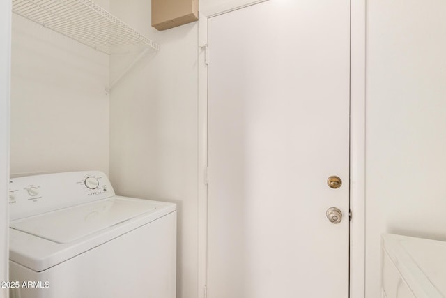 clothes washing area featuring washer / clothes dryer