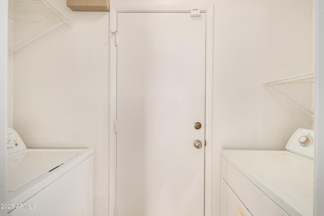 washroom with independent washer and dryer