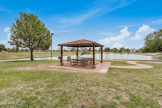 view of home's community featuring a gazebo, a lawn, and a water view