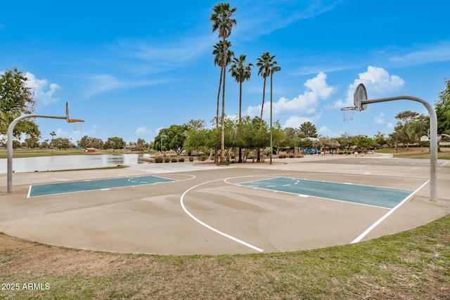view of sport court with community basketball court and a water view