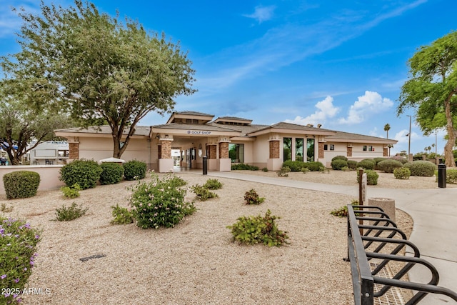 prairie-style house featuring stucco siding