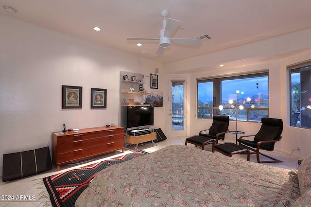 interior space with light tile patterned floors and ceiling fan