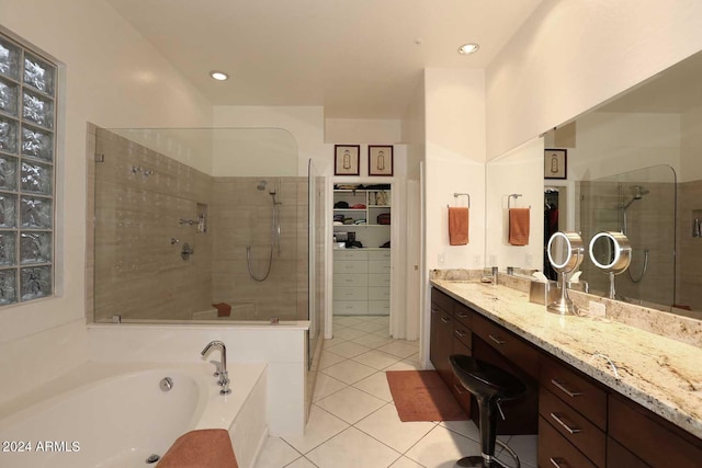 bathroom featuring vanity, separate shower and tub, and tile patterned floors