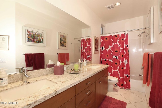 full bathroom with vanity, toilet, tile patterned floors, and shower / tub combo with curtain