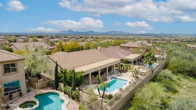 birds eye view of property featuring a mountain view