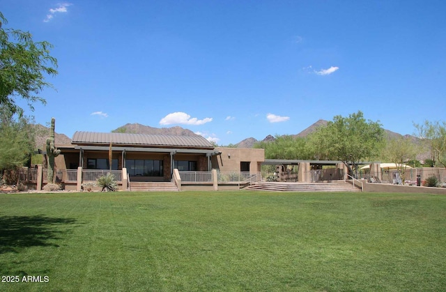 back of house featuring a lawn