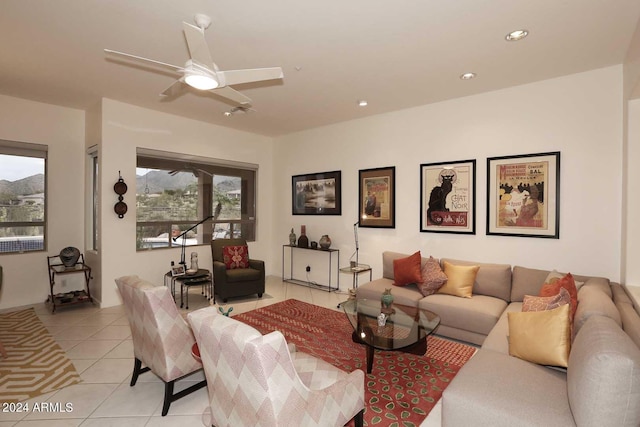 tiled living room featuring ceiling fan