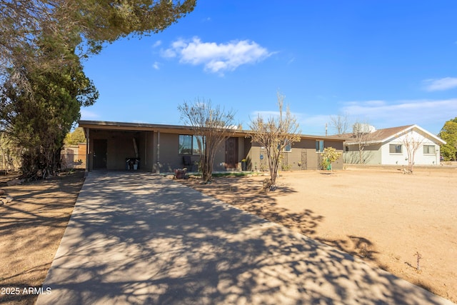 single story home featuring driveway