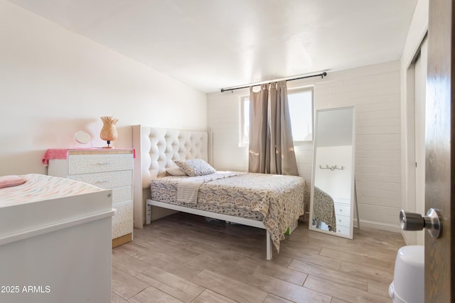 bedroom with light wood-type flooring