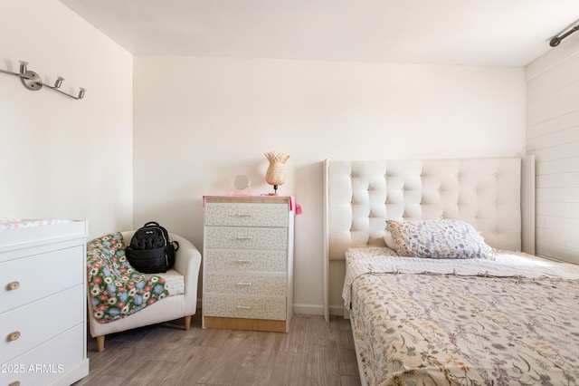 bedroom featuring light wood-style flooring