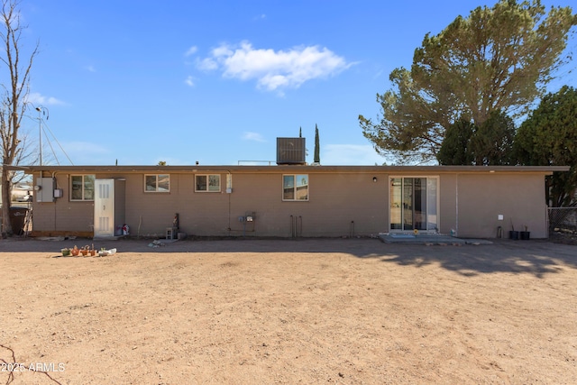 back of property featuring cooling unit