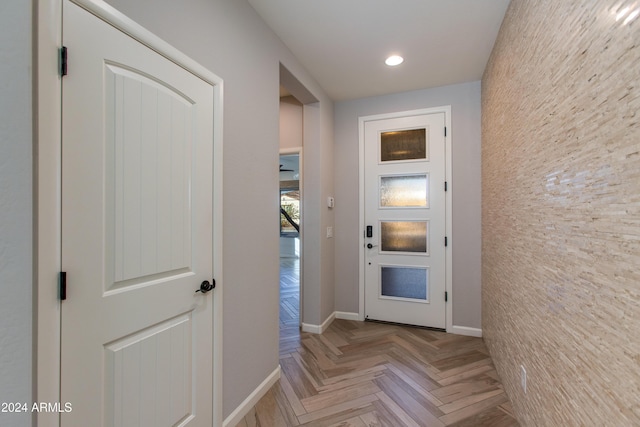 doorway to outside featuring light parquet flooring