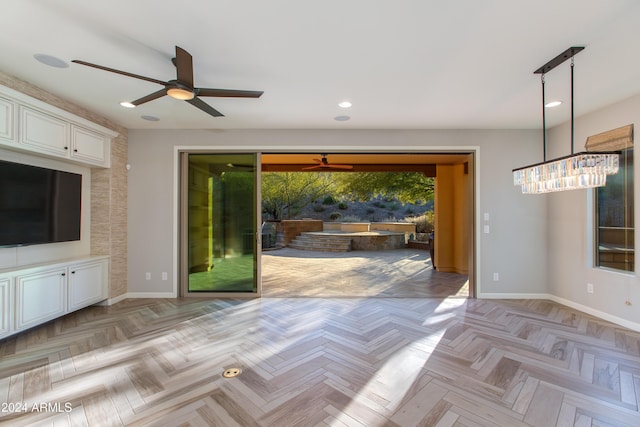 doorway to outside featuring ceiling fan and light parquet flooring