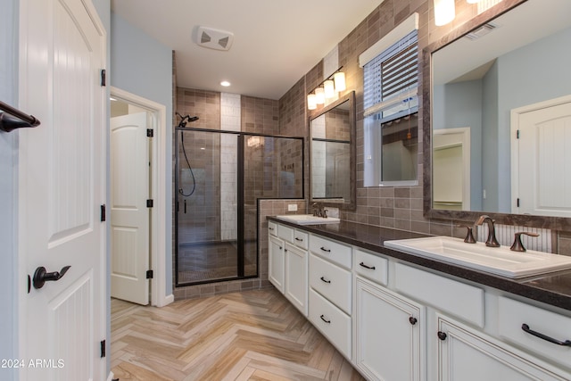 bathroom with vanity, decorative backsplash, parquet floors, and an enclosed shower