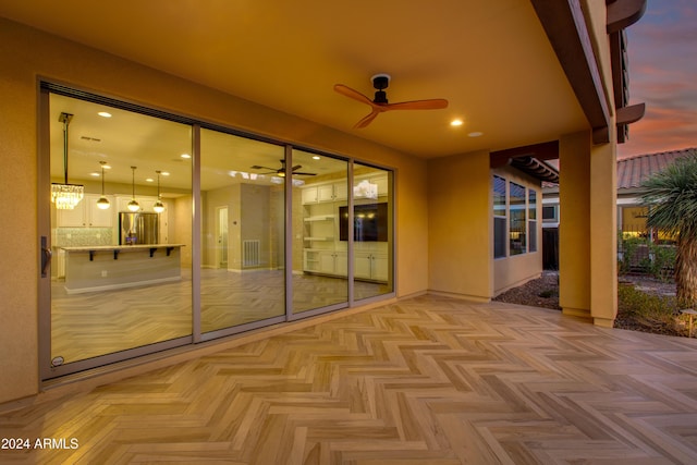 view of patio featuring ceiling fan