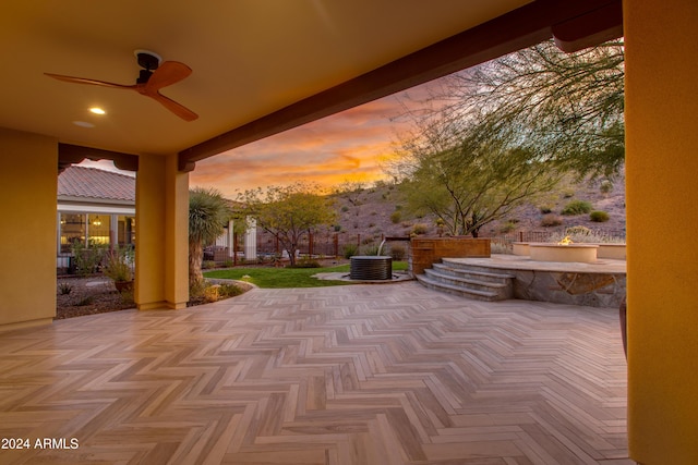 patio terrace at dusk with ceiling fan