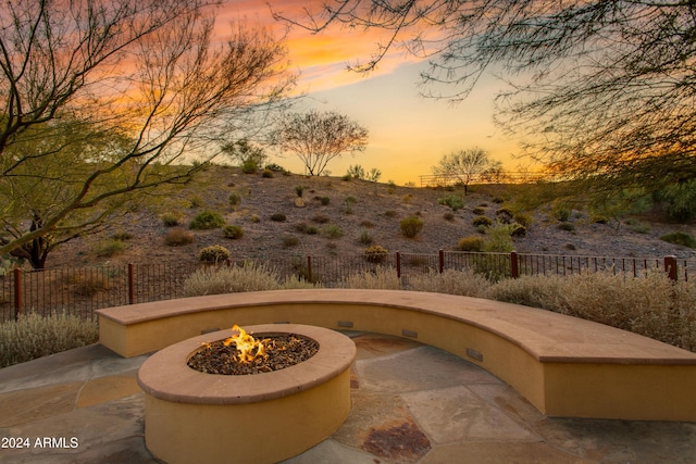 patio terrace at dusk with an outdoor fire pit