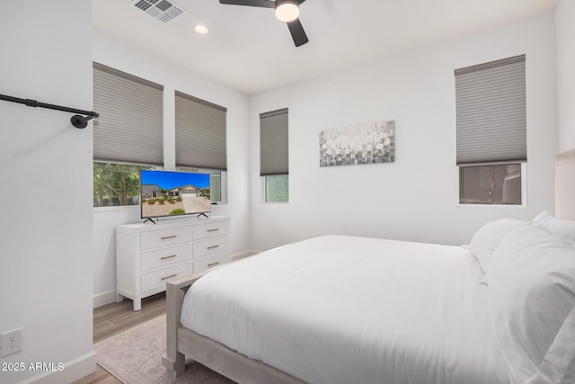 bedroom with visible vents, baseboards, recessed lighting, a ceiling fan, and light wood-style flooring