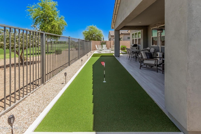 view of home's community featuring a patio area and fence