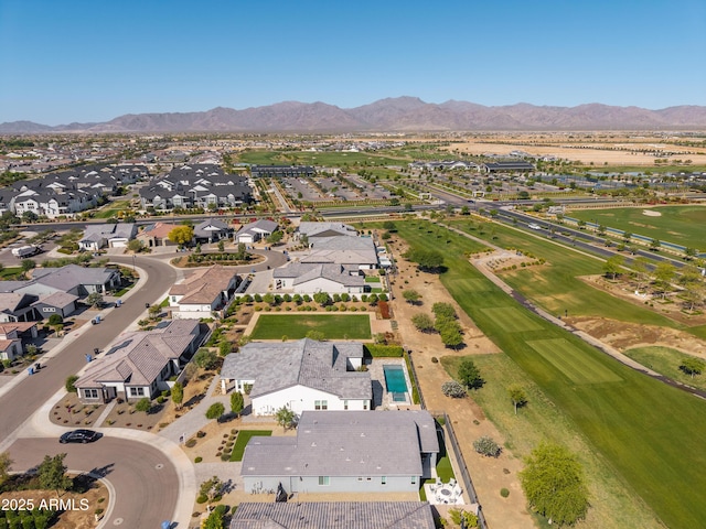 drone / aerial view featuring a residential view and a mountain view