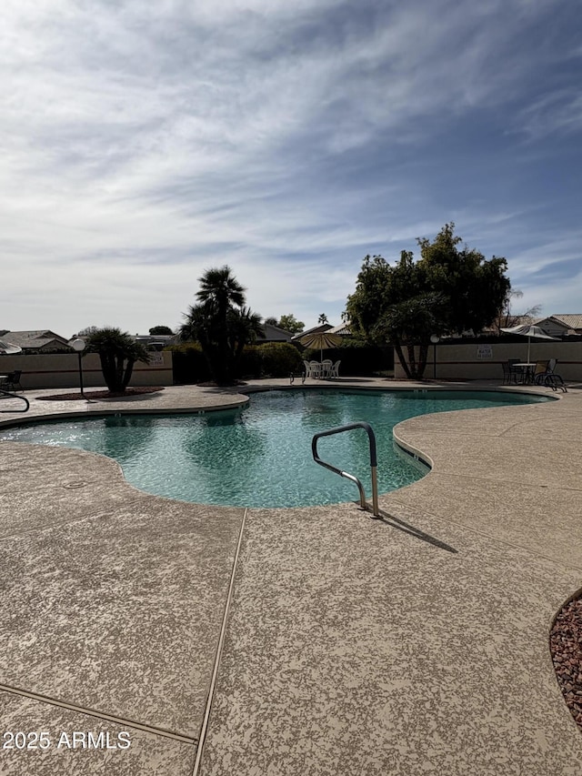 view of swimming pool featuring a patio