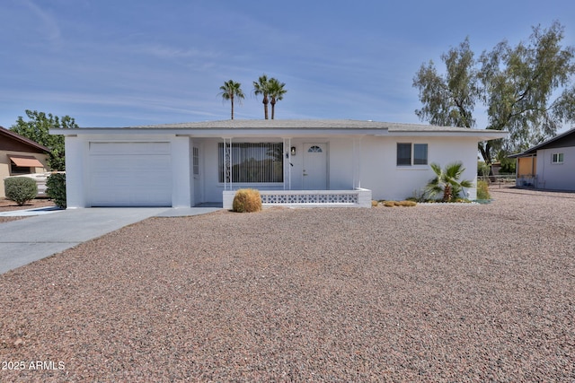 5510 E Dallas St, Mesa, AZ 85205 - ranch-style home with an attached garage, driveway, a porch, and stucco siding