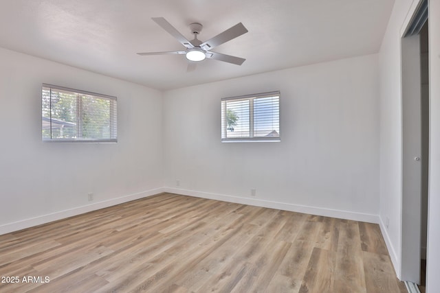 5510 E Dallas St, Mesa, AZ 85205 - empty room with healthy amount of natural light, light wood-type flooring, baseboards, and a ceiling fan