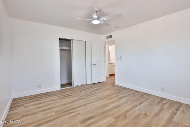 5510 E Dallas St, Mesa, AZ 85205 - unfurnished bedroom featuring baseboards, light wood finished floors, a closet, and ceiling fan