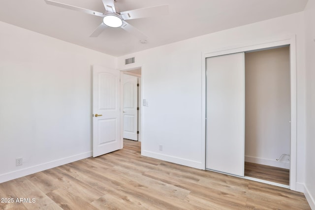 5510 E Dallas St, Mesa, AZ 85205 - unfurnished bedroom featuring light wood-type flooring, baseboards, a closet, and ceiling fan
