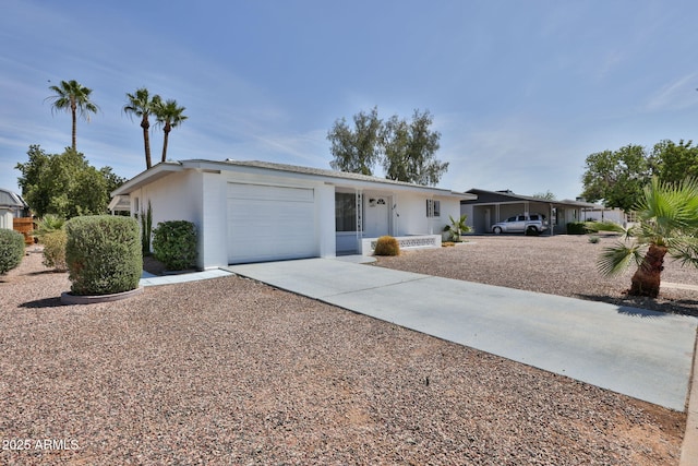 5510 E Dallas St, Mesa, AZ 85205 - ranch-style house featuring driveway, an attached garage, and stucco siding