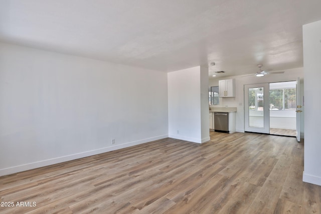 5510 E Dallas St, Mesa, AZ 85205 - unfurnished living room featuring light wood-style floors, baseboards, and ceiling fan
