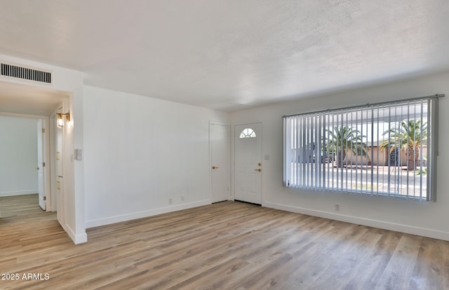 5510 E Dallas St, Mesa, AZ 85205 - foyer entrance with wood finished floors and baseboards