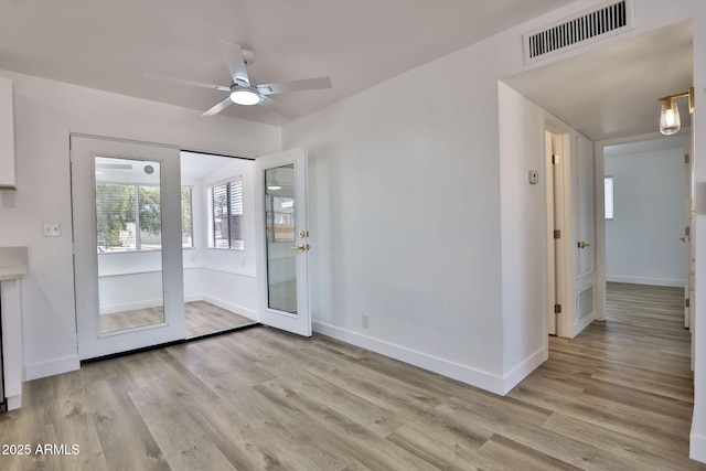 5510 E Dallas St, Mesa, AZ 85205 - unfurnished dining area featuring light wood finished floors, ceiling fan, and baseboards