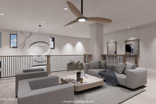 living room with ceiling fan and light hardwood / wood-style flooring