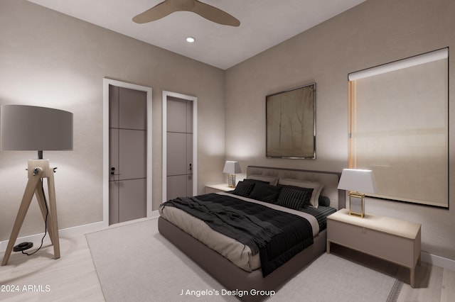 bedroom featuring ceiling fan and light hardwood / wood-style floors