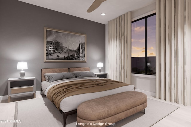 bedroom with hardwood / wood-style floors and ceiling fan