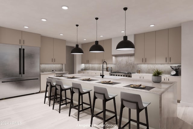 kitchen featuring pendant lighting, gray cabinets, decorative backsplash, appliances with stainless steel finishes, and light wood-type flooring