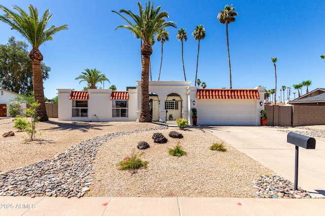 5211 E Winchcomb Dr, Scottsdale, AZ 85254 - view of front of home with stucco siding, driveway, and an attached garage