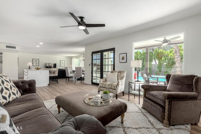 5211 E Winchcomb Dr, Scottsdale, AZ 85254 - living area featuring a ceiling fan and light wood-style floors
