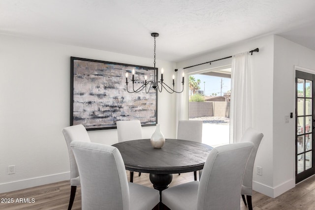 5211 E Winchcomb Dr, Scottsdale, AZ 85254 - dining area featuring a chandelier and light wood-style floors