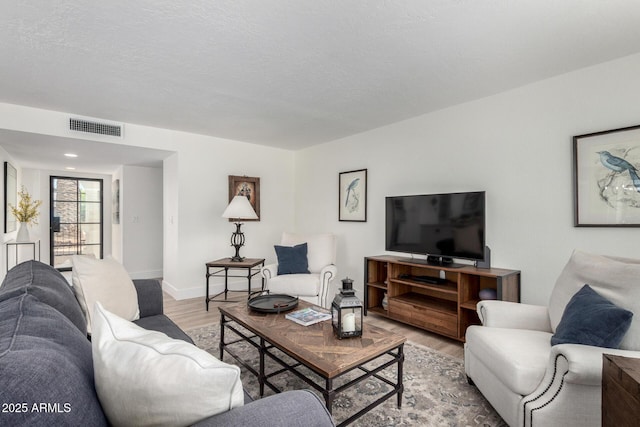 5211 E Winchcomb Dr, Scottsdale, AZ 85254 - living area featuring light wood-style flooring