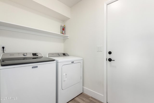 5211 E Winchcomb Dr, Scottsdale, AZ 85254 - washroom with separate washer and dryer and light wood-style flooring